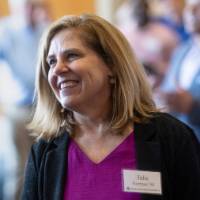 Julie Norman smiling at something off camera